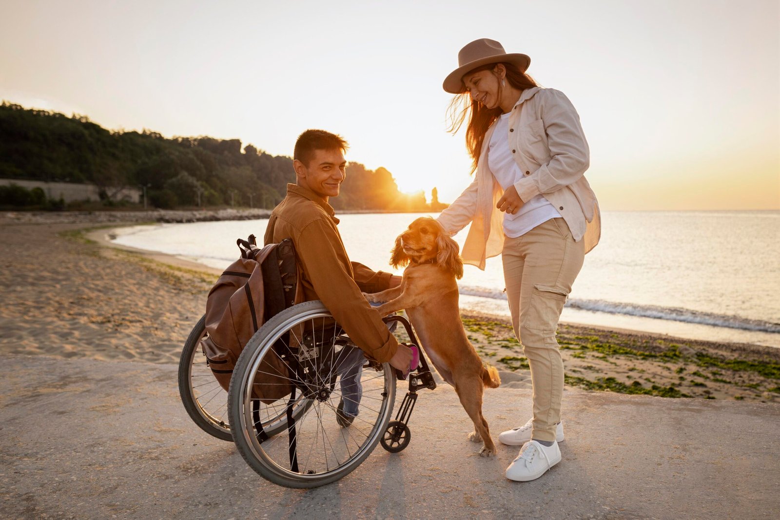 full-shot-smiley-couple-with-dog-seaside